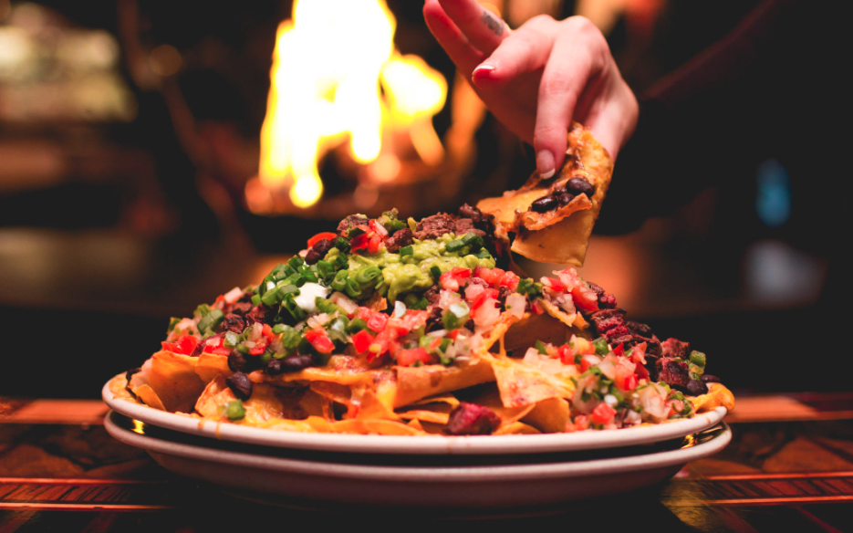 La Patroncita signature dishes Carnitas NachosEnchiladasGuacamole, Chips, & Salsa